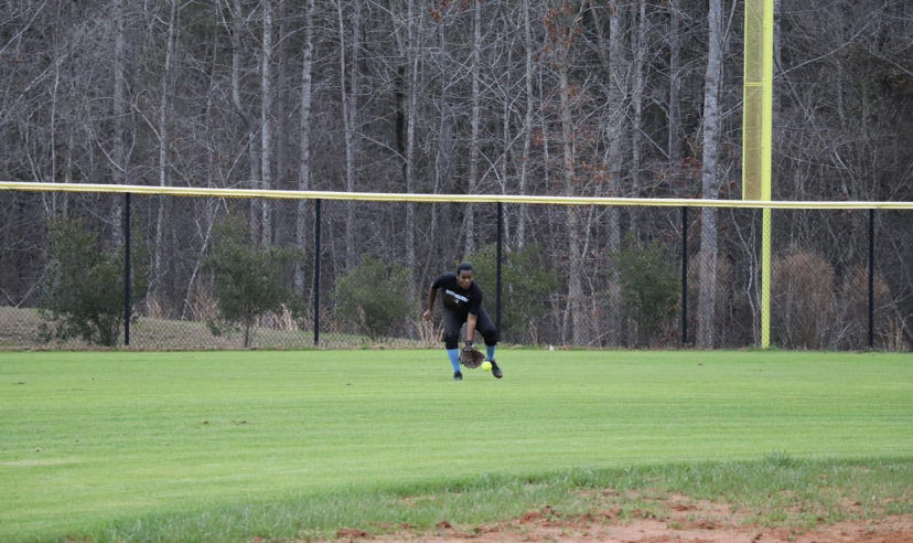 Nia Spells shows off her softball skills.