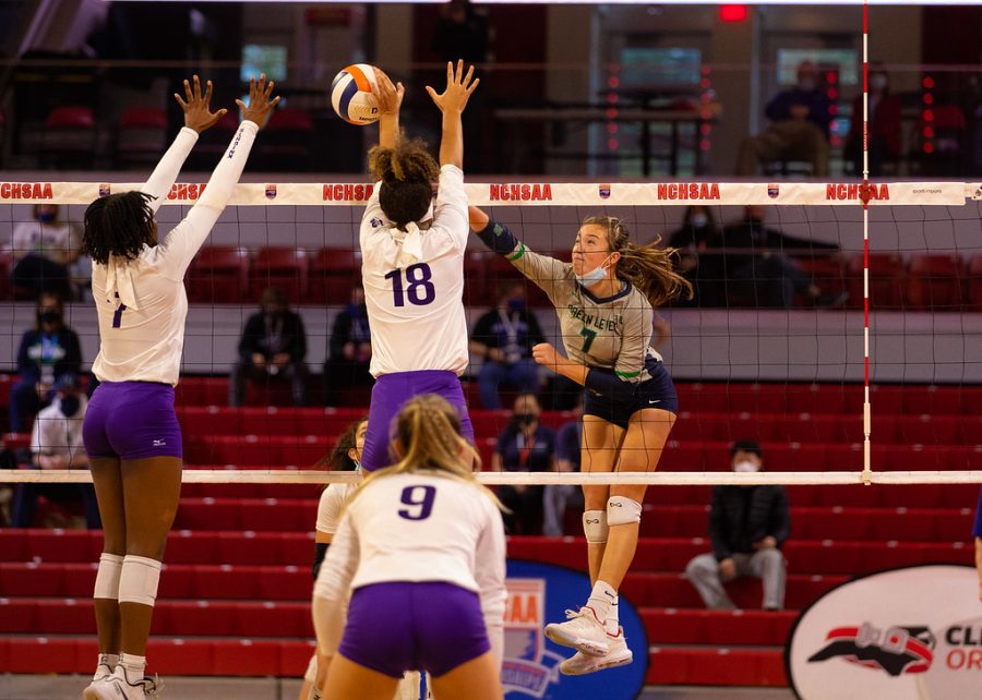 Morgan(7) goes for a kill against the Ardrey Kell block!