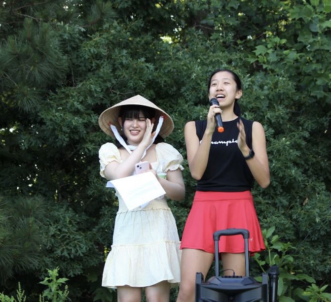 Audrey Sun and Emily Chen announce the next performers.