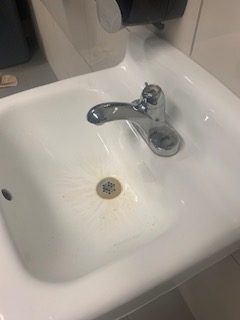 Mystery brown stains and an entire sink handle ripped off? Double whammy. 