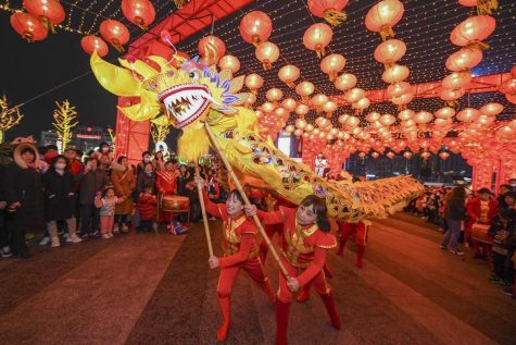 Folk artists perform dragon dance during a lantern show to celebrate the Lantern Festival at a shopping mall on February 26, 2021 in Changsha, Hunan Province of China. 