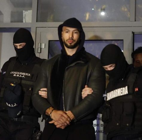 Andrew Tate being detained by Romanian authorities.