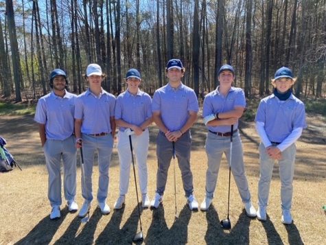 Mens golf team pose for picture before teeing off at Falls Village