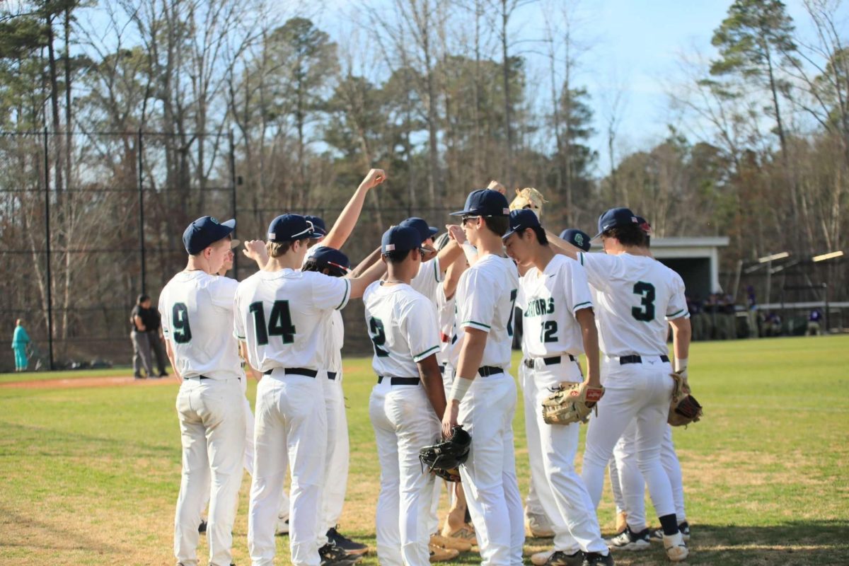 The huddle was electric as the baseball team gathered and discussed their play. 