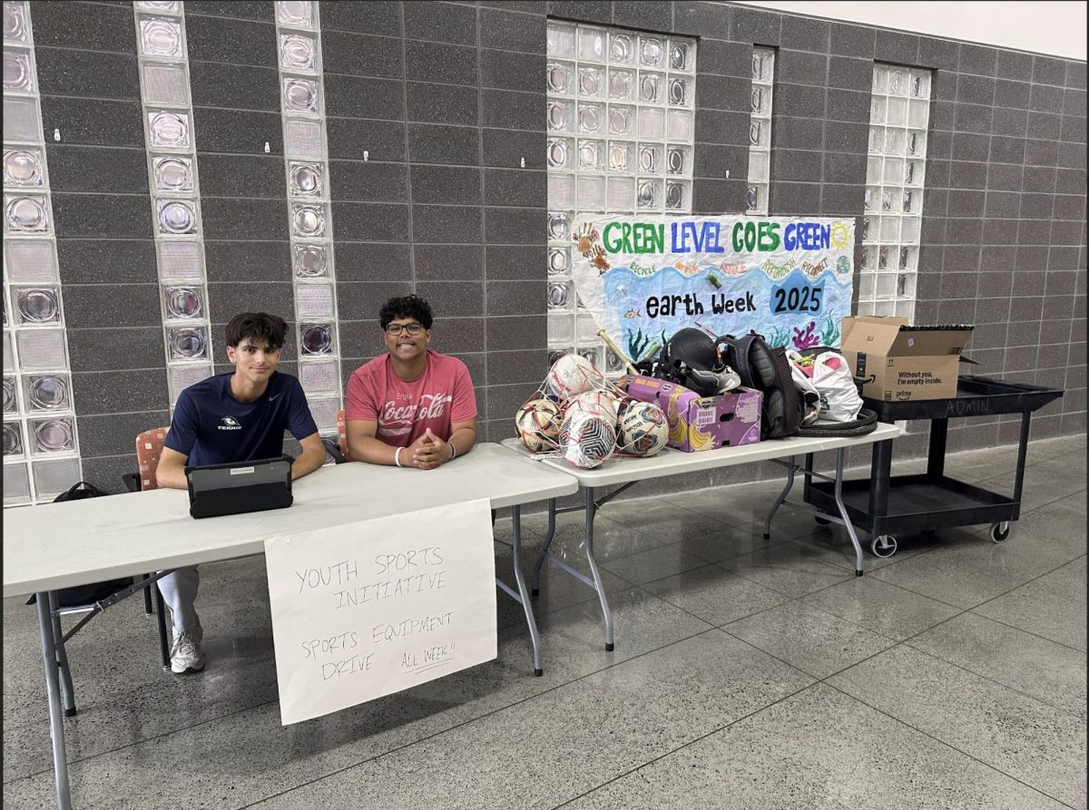 One of YSI’s various sports equipment drives at the front entrance of the school, featuring some of the club leaders, James Torbey (left) and Rishi Saha (right).