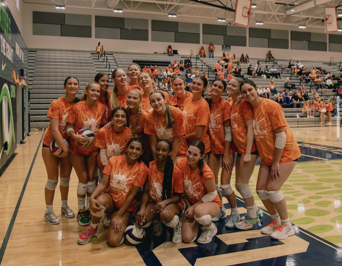 The volleyball team in their Orange Out T-shirts before the game. 