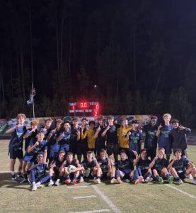 The men's soccer team celebrates a major win against Middle Creek