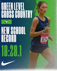 Junior Naomi Greengrass with her new personal record time at 18:28.1